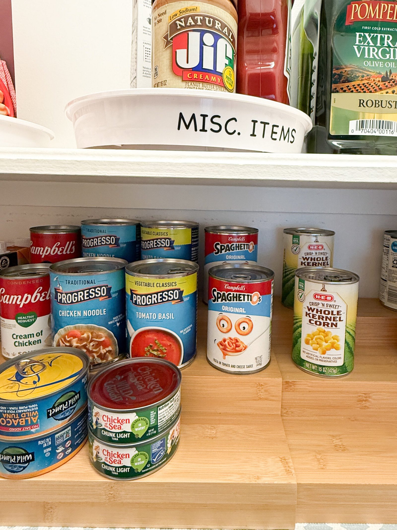 Pantry organization corner featuring can shelf storage. This storage idea makes it easy to see and find the cans when you open your pantry.