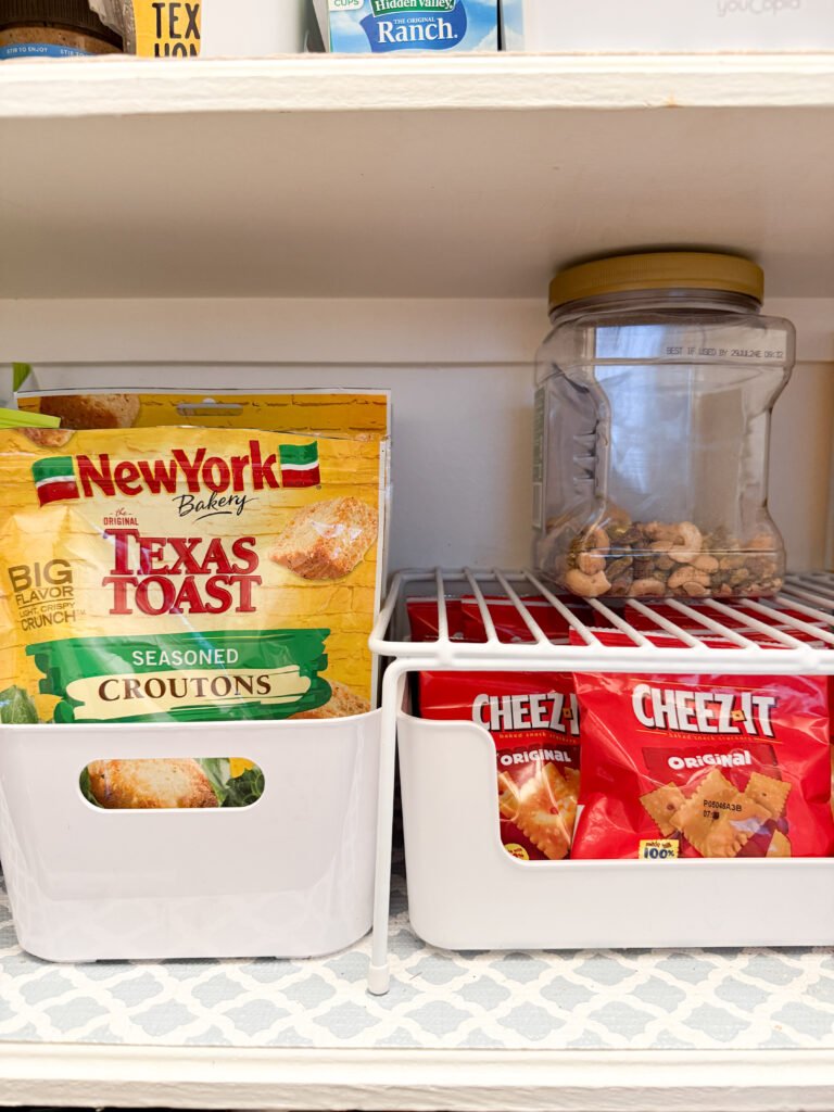 Pantry Organizing corner featuring labeled snack containers for simple organization. This makes it easy to find things and put items back where they go. 