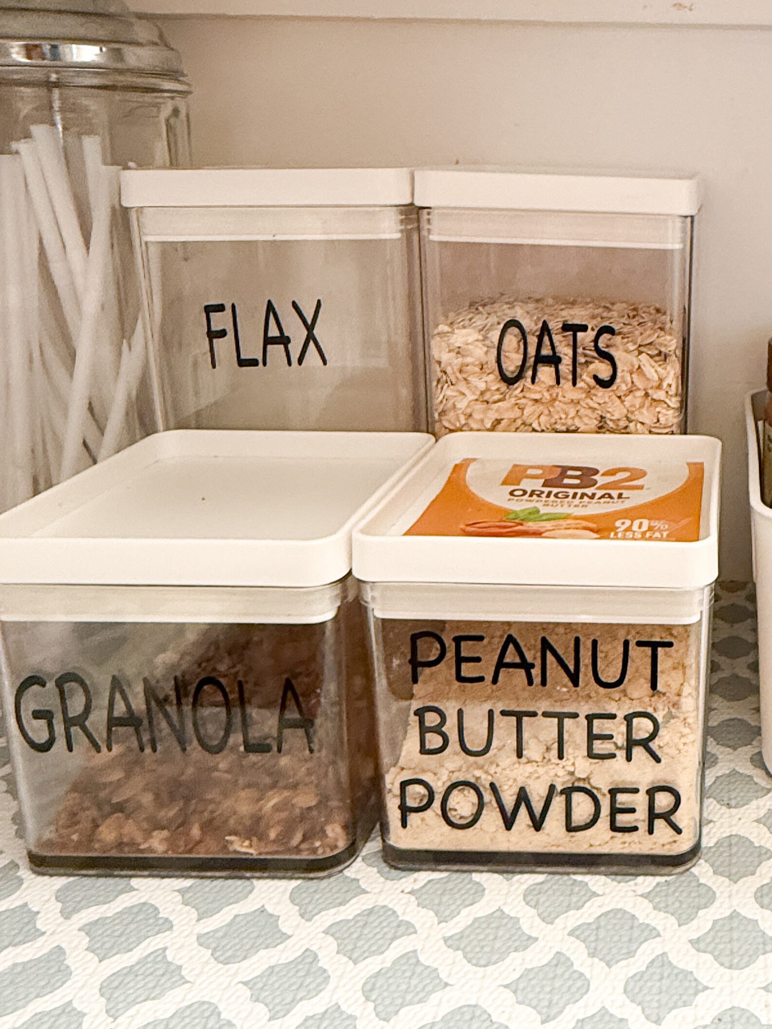 Organized pantry corner featuring labeled oatmeal and granola options. This makes it easy to find the items when you need them.