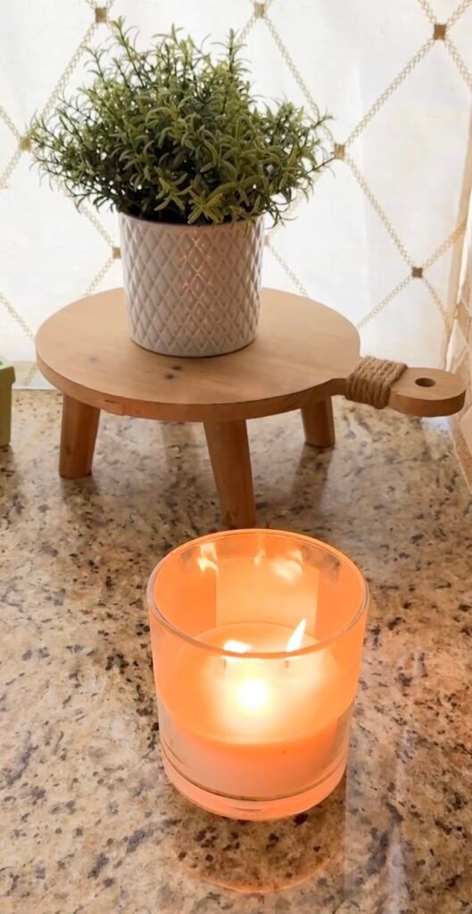 Before you declutter - set the mood. Light a candle to create a cozy atmosphere.