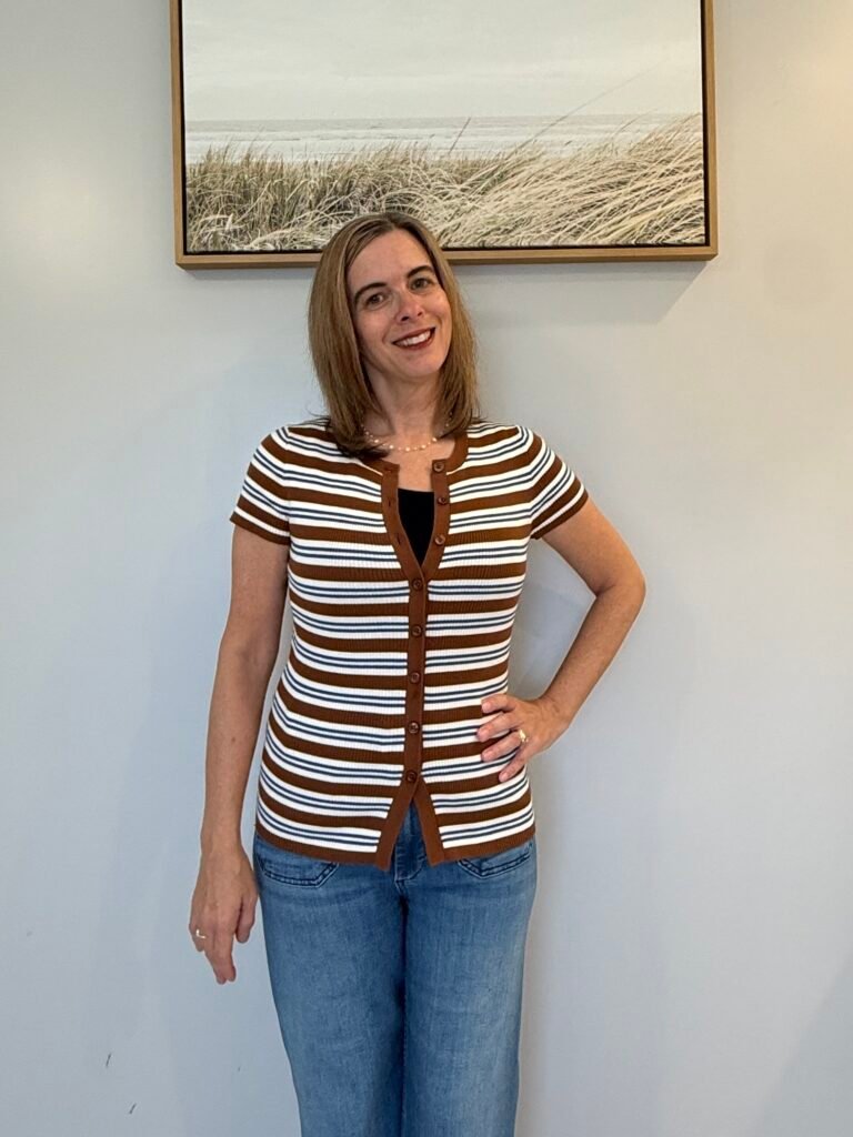 Women Over 40 wearing a cardigan with buttons open at the top and bottom for an elevated style look.